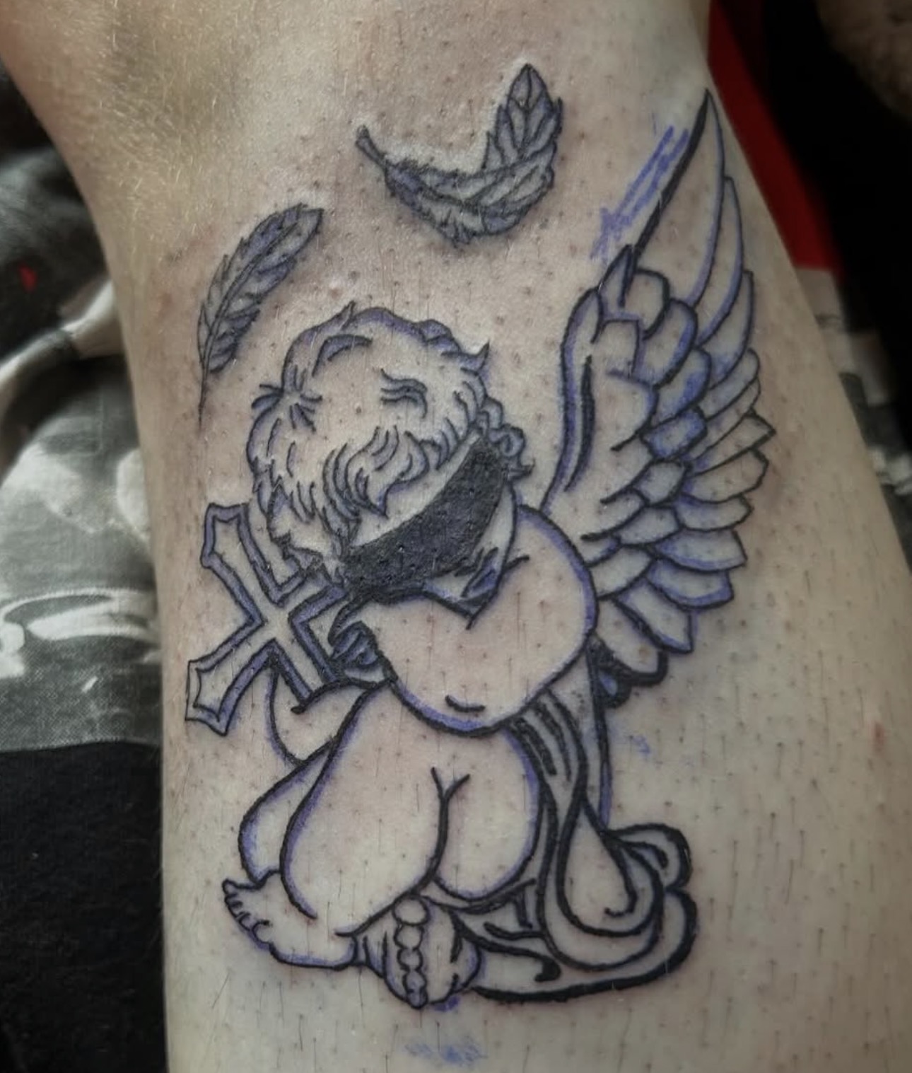 Cherub with Cross — Illustrative Black & Grey tattoo by Xandria