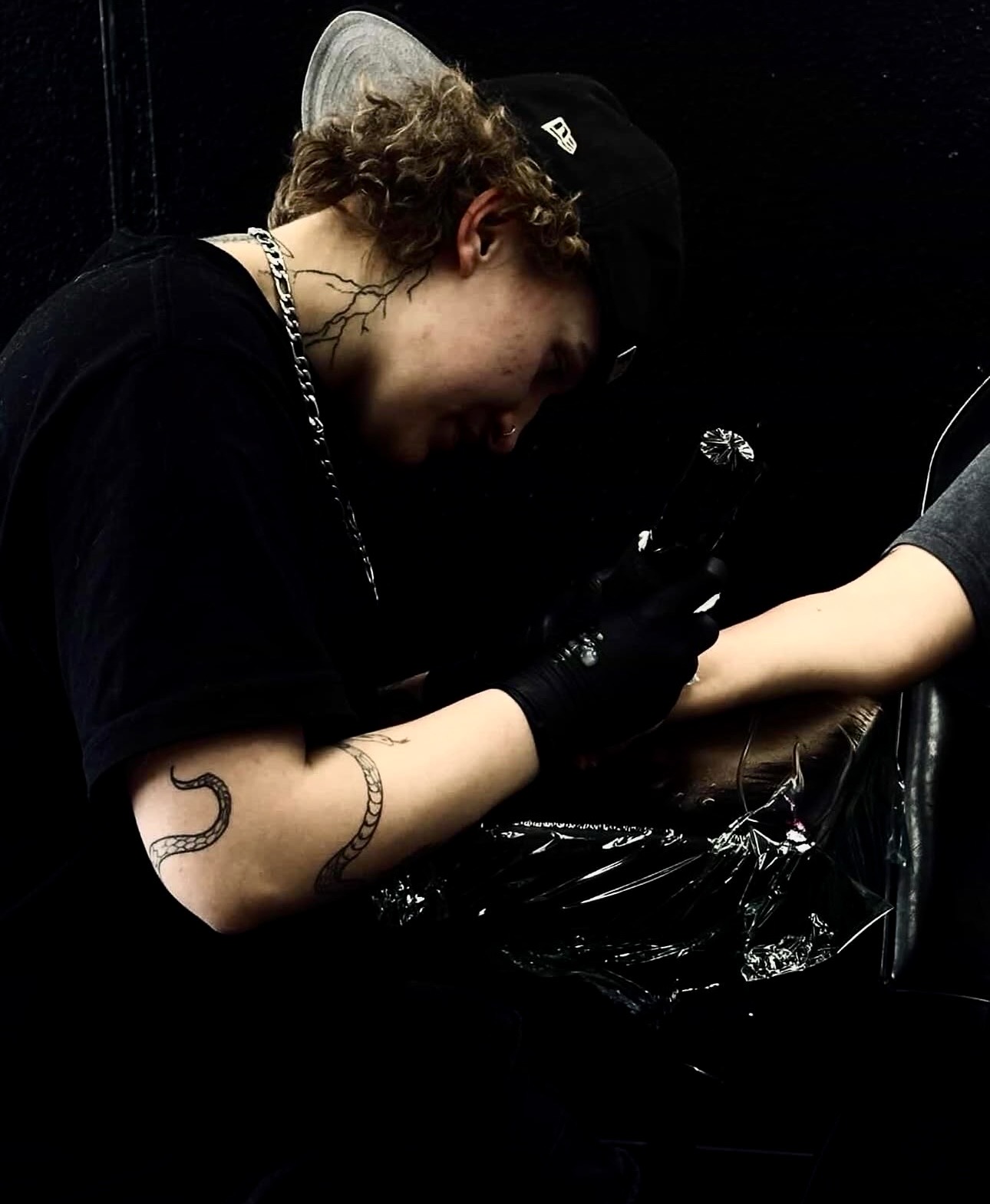 Xandria tattooing a client at Ancient Ink Tattoo